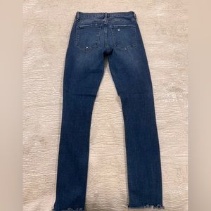 Blue skinny low rise jeans with ripped details